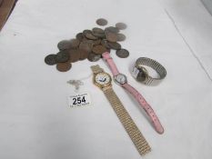 A small quantity of copper coins and 3 wrist watches