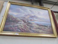 A gilt framed country scene