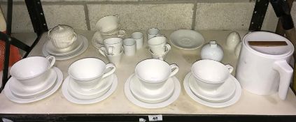 A shelf of white pottery