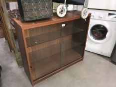 A glazed 3 shelf display cabinet