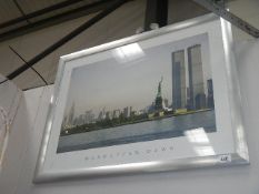 A framed and glazed print entitled Manhattan Dawn