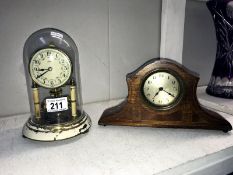 An inlaid mahogany mantle clock & an anniversary clock under glass dome