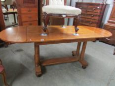 An oak drop side table.