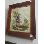 A framed Victorian woolwork of a Gentleman hunter/poacher smoking a pipe.