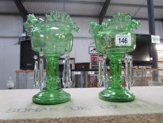 A pair of Victorian green glass lustres