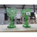 A pair of Victorian green glass lustres