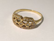 An 18ct yellow gold ring set oval diamond with diamond surround,