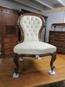 A mahogany framed ladies chair.