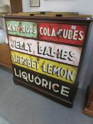 A mahogany 2 over 3 chest of drawers with painted advertising