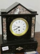 An Edwardian black slate mantel clock.