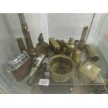 A collection of brass trench art lighters including table top, cannon model, RAF,