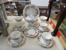 A 16 piece Wedgwood Hathaway Rose tea set comprising tea pot, milk jug, sugar bowl, sandwich plate,
