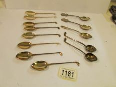 A set of 8 and a pair of silver golf themed teaspoons and 3 other silver teaspoons (approximately