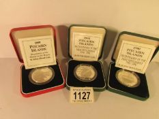 2 x 1990 silver proof Pitcairn islands one dollar coins and a 1989 silver proof Pitcarin islands 1