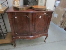 A mahogany 2 door cabinet