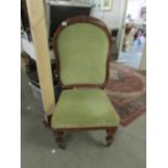 A mahogany framed nursing chair.