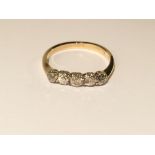 An 18ct 5 stone yellow gold diamond bar ring,
