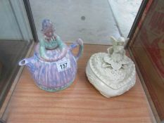 An Arthur Wood character teapot and a heart shaped powder pot surmounted fairy