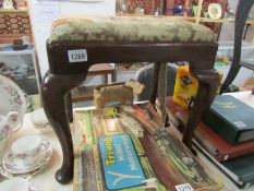 An 18th century Georgian pad foot stool with tapestry seat.