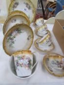 A part china tea set marked 'Victoria Austria'