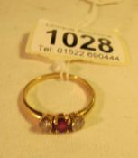 A gold ring set ruby and 2 diamonds, hallmark worn, (approx,