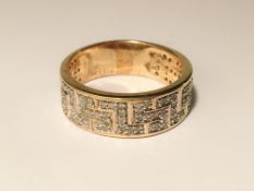 A yellow gold Greek key diamond ring,