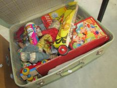 A suitcase of old toys and games
