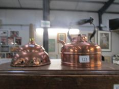 A copper kettle and a copper washing dolly