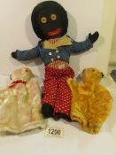 A vintage golly and Sooty and Sue glove puppets