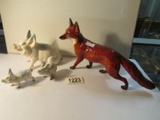 3 Beswick pigs and a Beswick fox