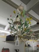 A coloured metal floral ceiling light.