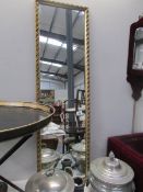 A gilt framed mirror