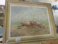 A framed oil on boar painting by Jack Strickland (20th century school) of 'Boats on the Beach at