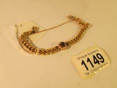 A ladies gold bracelet set with ruby and seed pearls and with German hall mark,