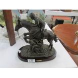 A horse and jockey figure on stand