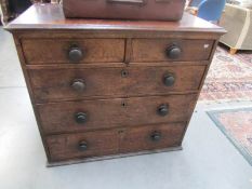 An oak 2 over 3 chest of drawers