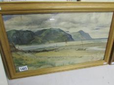 A framed and glazed watercolour of coastal scene with figures sy J.W.Fletcher, signed.