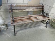 A metal and wood garden bench.