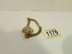 An 18ct gold ladies wristwatch on a later rolled gold bracelet