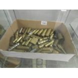 A collection of brass trench art lighters, bullets,