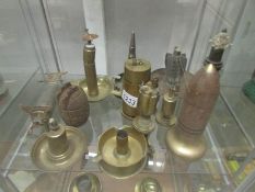 A collection of brass trench art lighters including table top, grenade, ash tray,