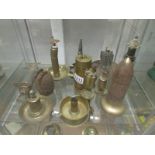 A collection of brass trench art lighters including table top, grenade, ash tray,