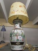 An oriental table lamp with shade
