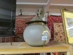 A brass and glass porch lantern