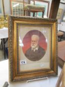 A framed and glazed portrait of Victor Hugo