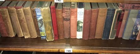 A shelf of early fiction and antiquarian including Ungava,
