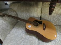 A Peavey acoustic guitar,