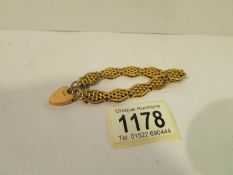A 9ct gold bracelet with padlock,