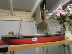 A wooden model of a fishing boat.