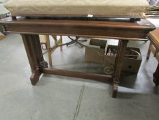 A modern mahogany side table